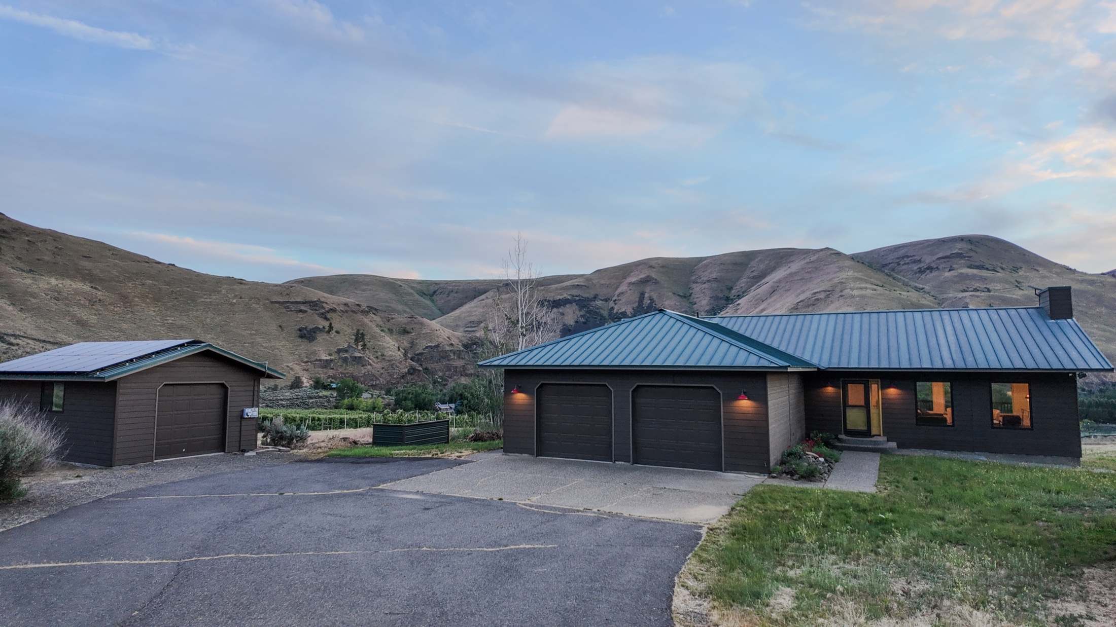Front of Canyon Basin House with the Yakima River Canyon hills behind it, a quiet basecamp for the Ellensburg Rodeo