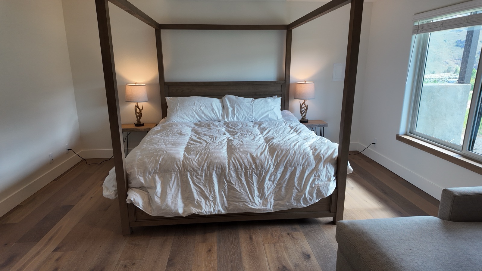 Canopy king bed in the downstairs suite at Canyon Basin House